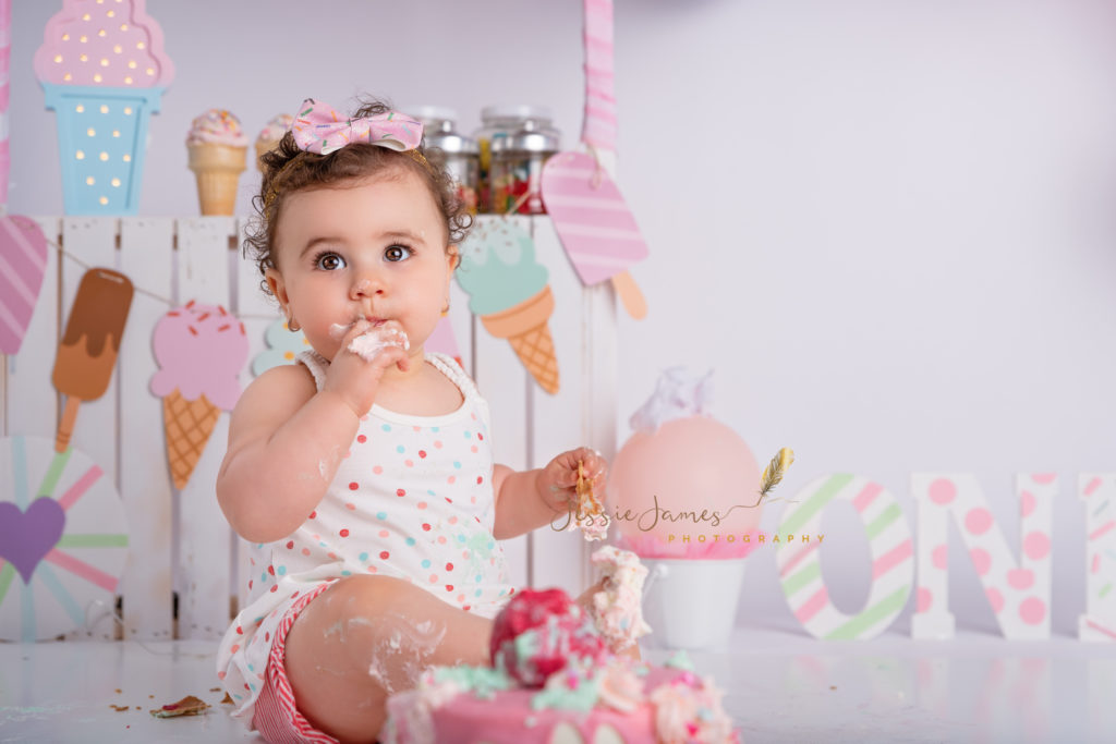 baby eating birthday cake, baby girl smashing birthday cake