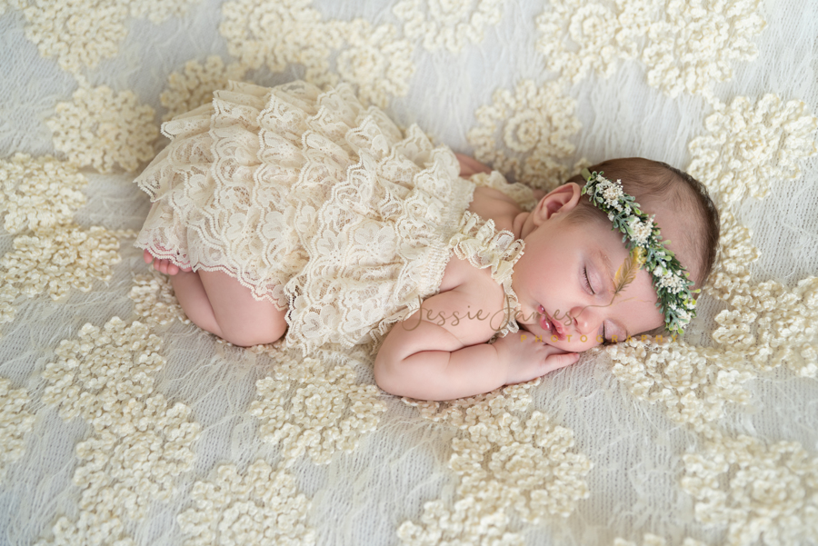newborn photography, baby sleeping on a cream colored blanket