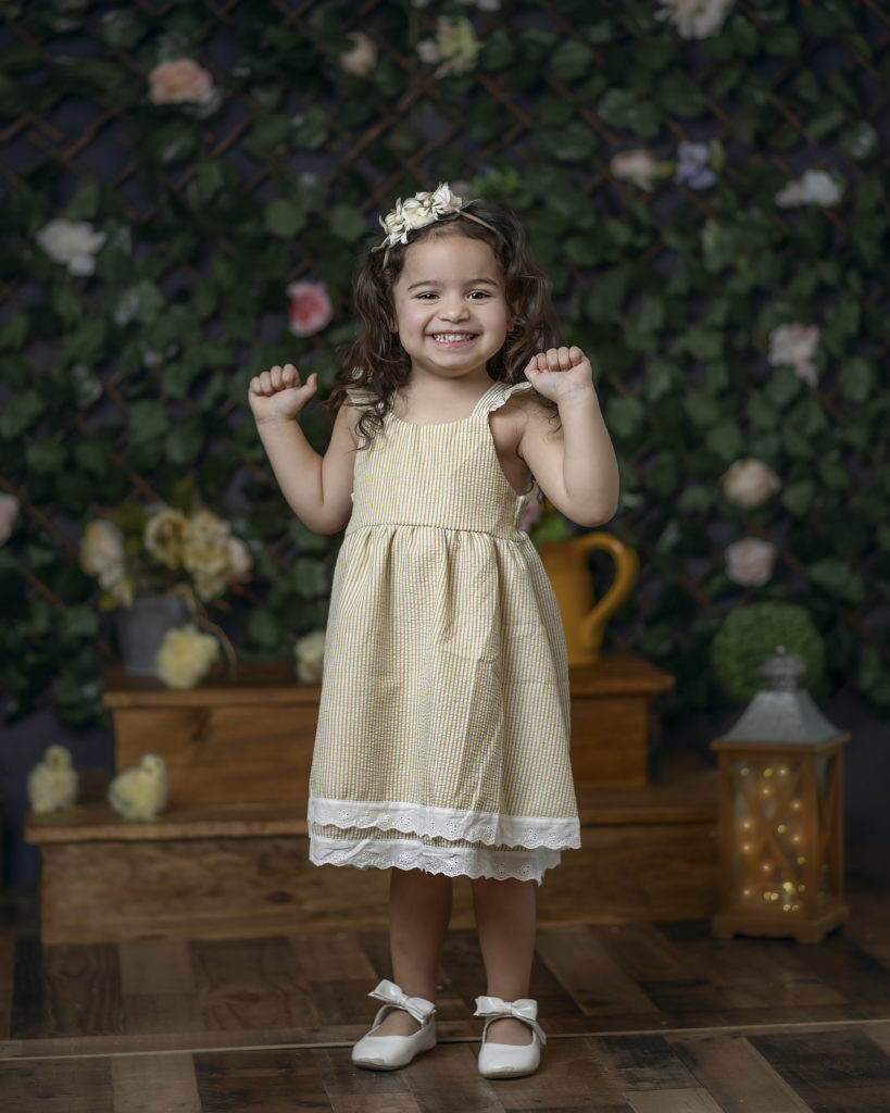 Spring Mini Sessions, little girl in a yellow dress smiling. 