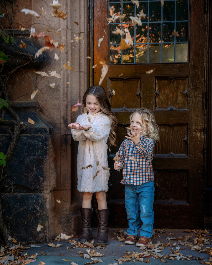(Two kids tossing leaves in front of Princeton door)
Keyphrase: Fall Mini Session Princeton University